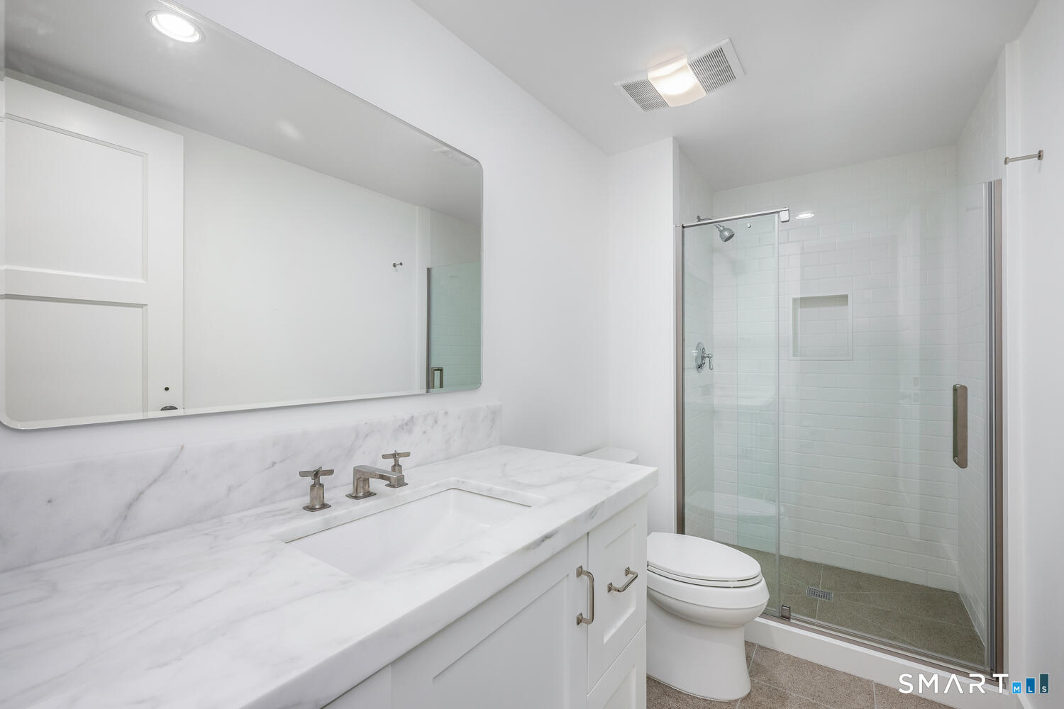 32 Birch Road Darien, CT 06820 - Photo 32 of 40 a bathroom with a granite countertop sink a toilet and shower