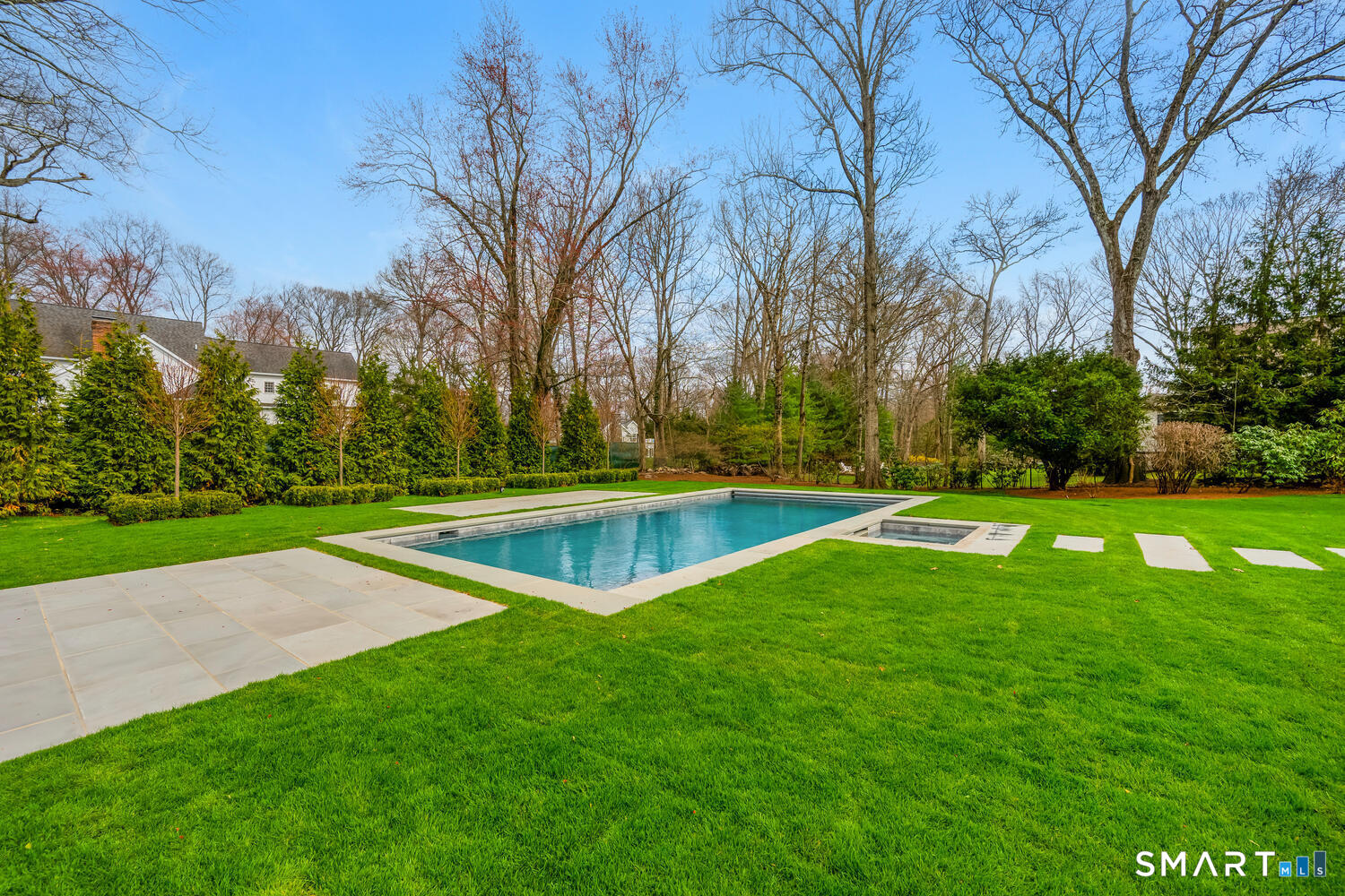 32 Birch Road Darien, CT 06820 - Photo 37 of 40 a view of a swimming pool with a yard
