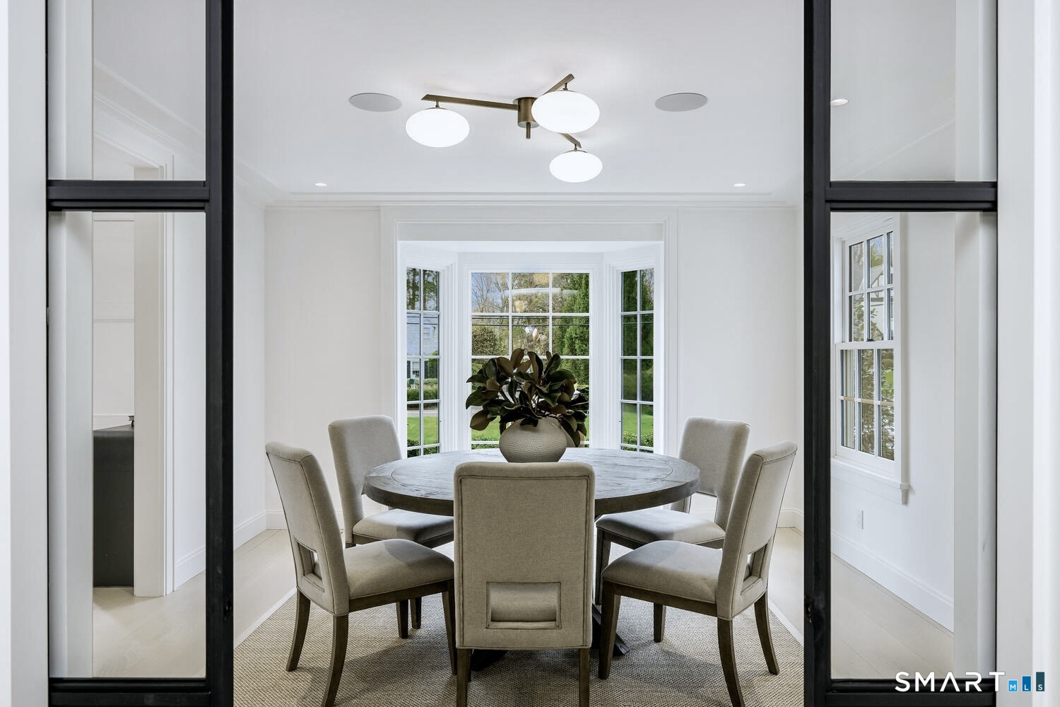 32 Birch Road Darien, CT 06820 - Photo 9 of 40 a view of a dining room with furniture and a window