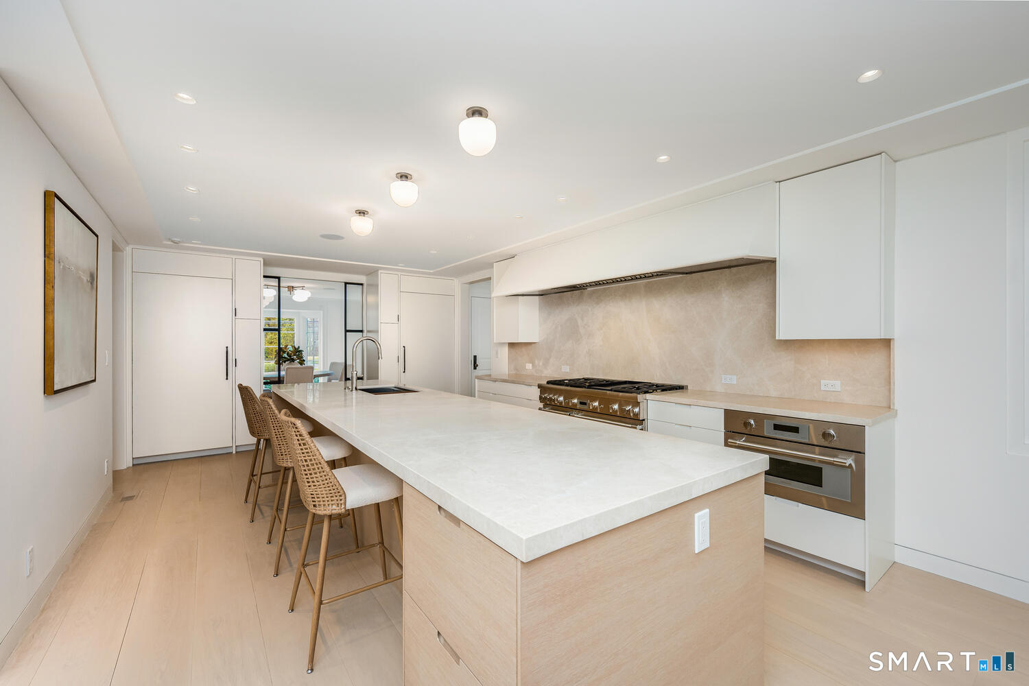 32 Birch Road Darien, CT 06820 - Photo 10 of 40 a kitchen with a stove a table and chairs