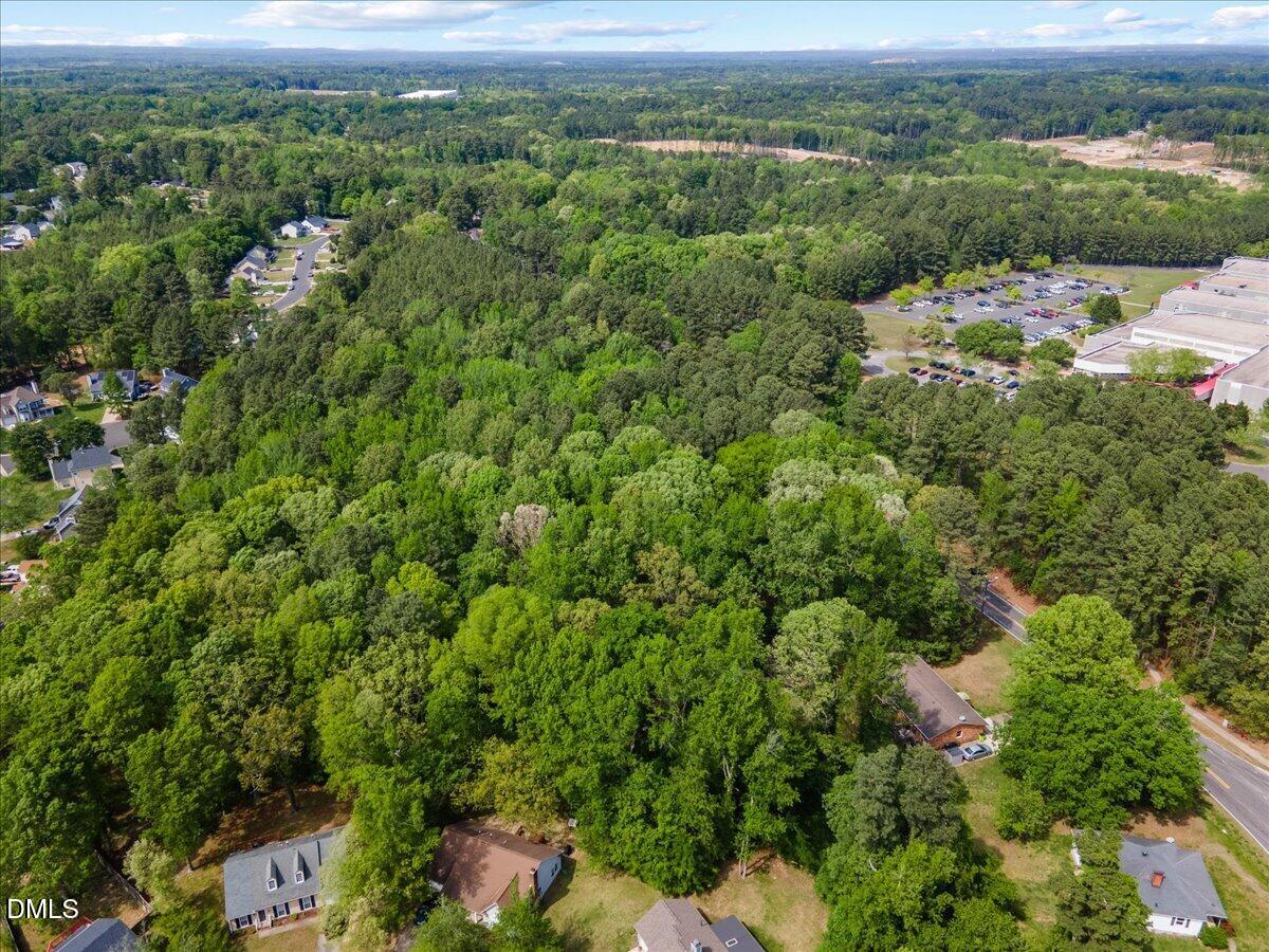 631-633 Clayton Road Durham, NC 27703 - Photo 7 of 17 an aerial view of residential houses with outdoor space and trees
