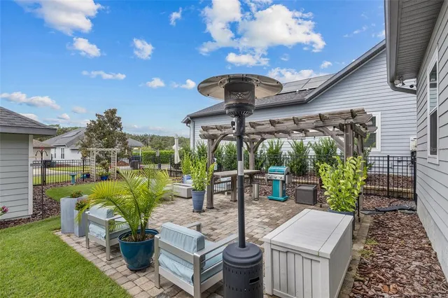 a view of a patio with a dining table and chairs