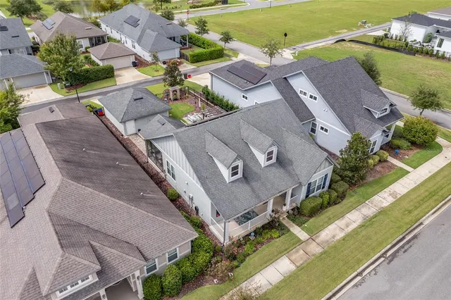 an aerial view of a house with a garden