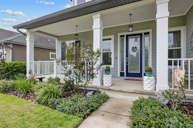 a front view of a house with a glass door and glass door