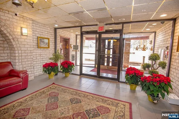 a living room with furniture and flowers