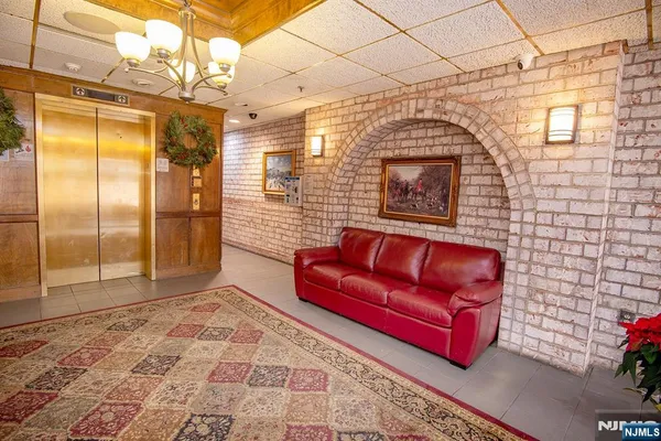 a view of livingroom with furniture and a fireplace