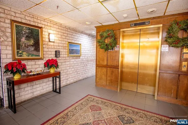 a view of a room with a table and a potted plant