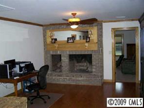 2079 Daytime Road Lancaster, SC 29720 - Photo 7 of 8 a living room with furniture and a fireplace