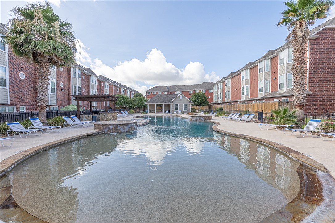 1198 Jones-Butler Road, Unit 2007 College Station, TX 77840 - Photo 8 of 10 a view of a house with pool and sitting area