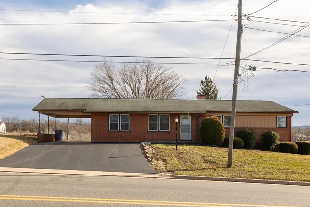 a view of a brick house with a street