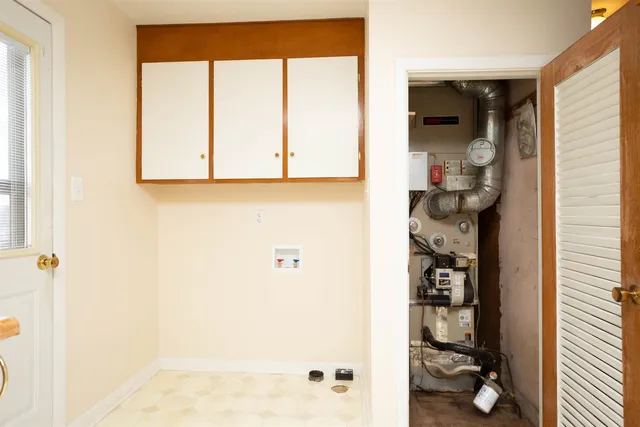 a bathroom with a window and a shower