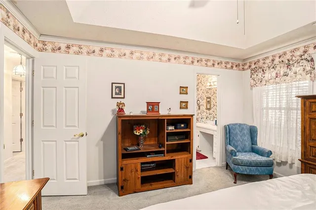 a bathroom with a sink vanity mirror and toilet