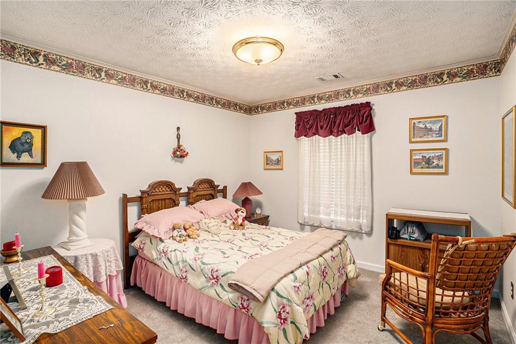 30 Spring Valley Drive Covington, GA 30016 - Photo 20 of 28 a bedroom with bed and a window