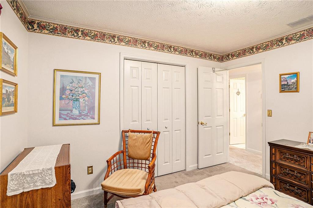 30 Spring Valley Drive Covington, GA 30016 - Photo 21 of 28 a chair and a table in a room