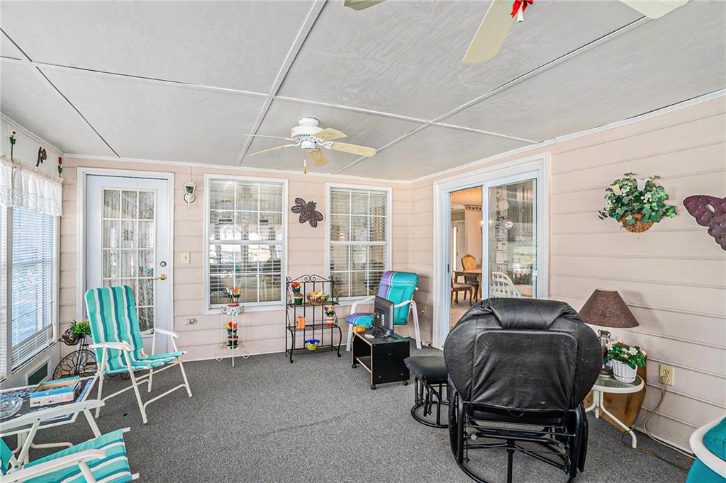 30 Spring Valley Drive Covington, GA 30016 - Photo 24 of 28 a living room with furniture and a floor to ceiling window