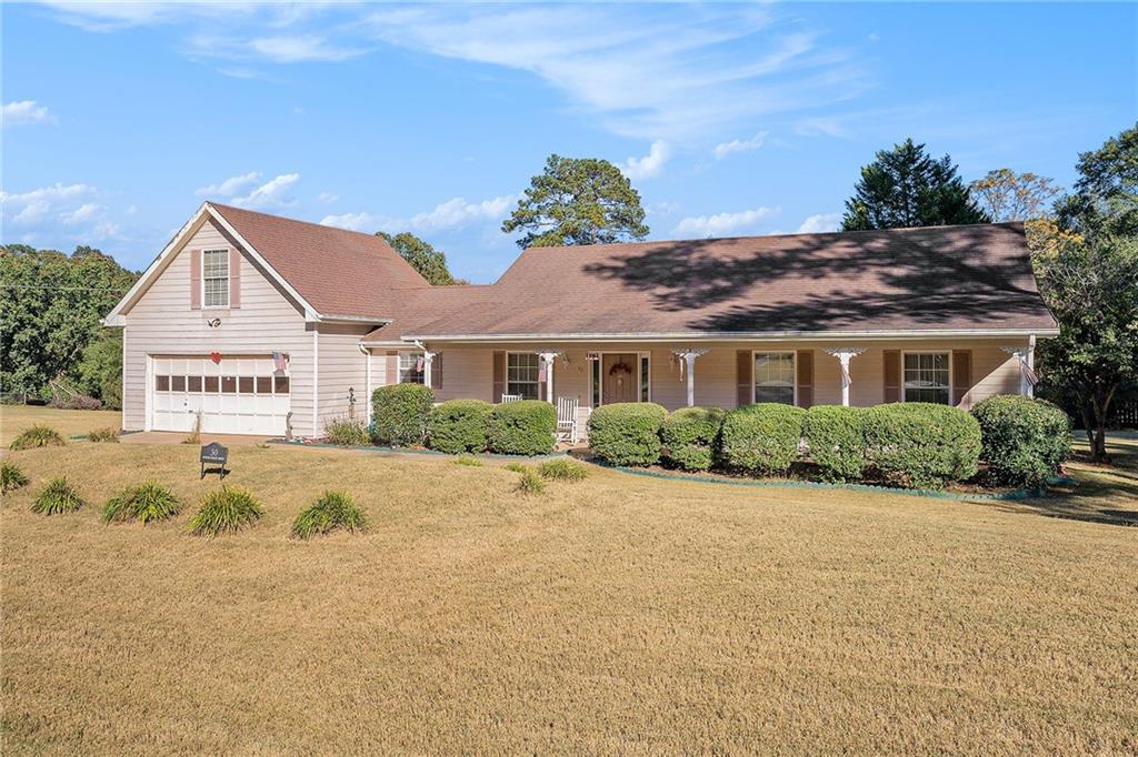 30 Spring Valley Drive Covington, GA 30016 - Photo 26 of 28 a view of a house with a yard