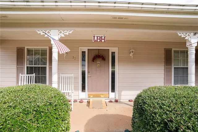 a view of entryway with furniture and chandelier