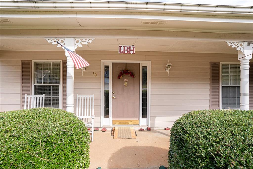30 Spring Valley Drive Covington, GA 30016 - Photo 3 of 28 a front view of a house with a garage