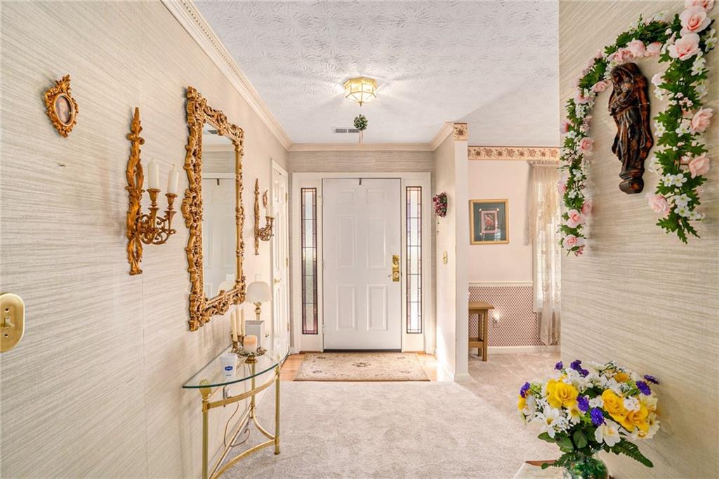 30 Spring Valley Drive Covington, GA 30016 - Photo 4 of 28 a view of entryway with furniture and chandelier