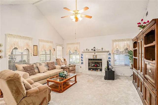 a dining room with furniture a chandelier and wooden floor
