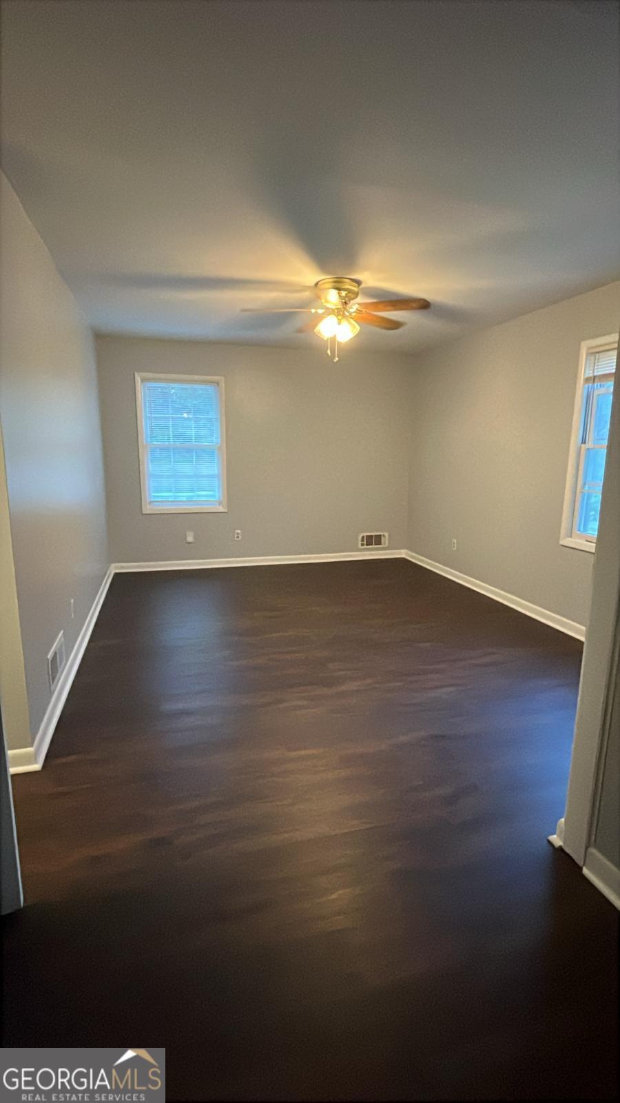 3753 Columbia Parkway Decatur, GA 30034 - Photo 11 of 14 a view of an empty room with wooden floor and a window