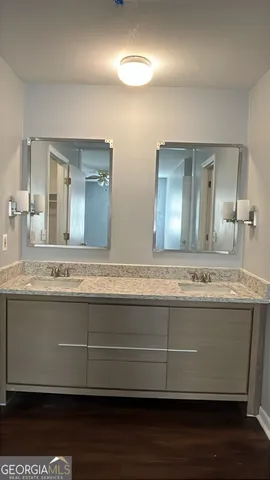 a view of a kitchen counter space and wooden floor