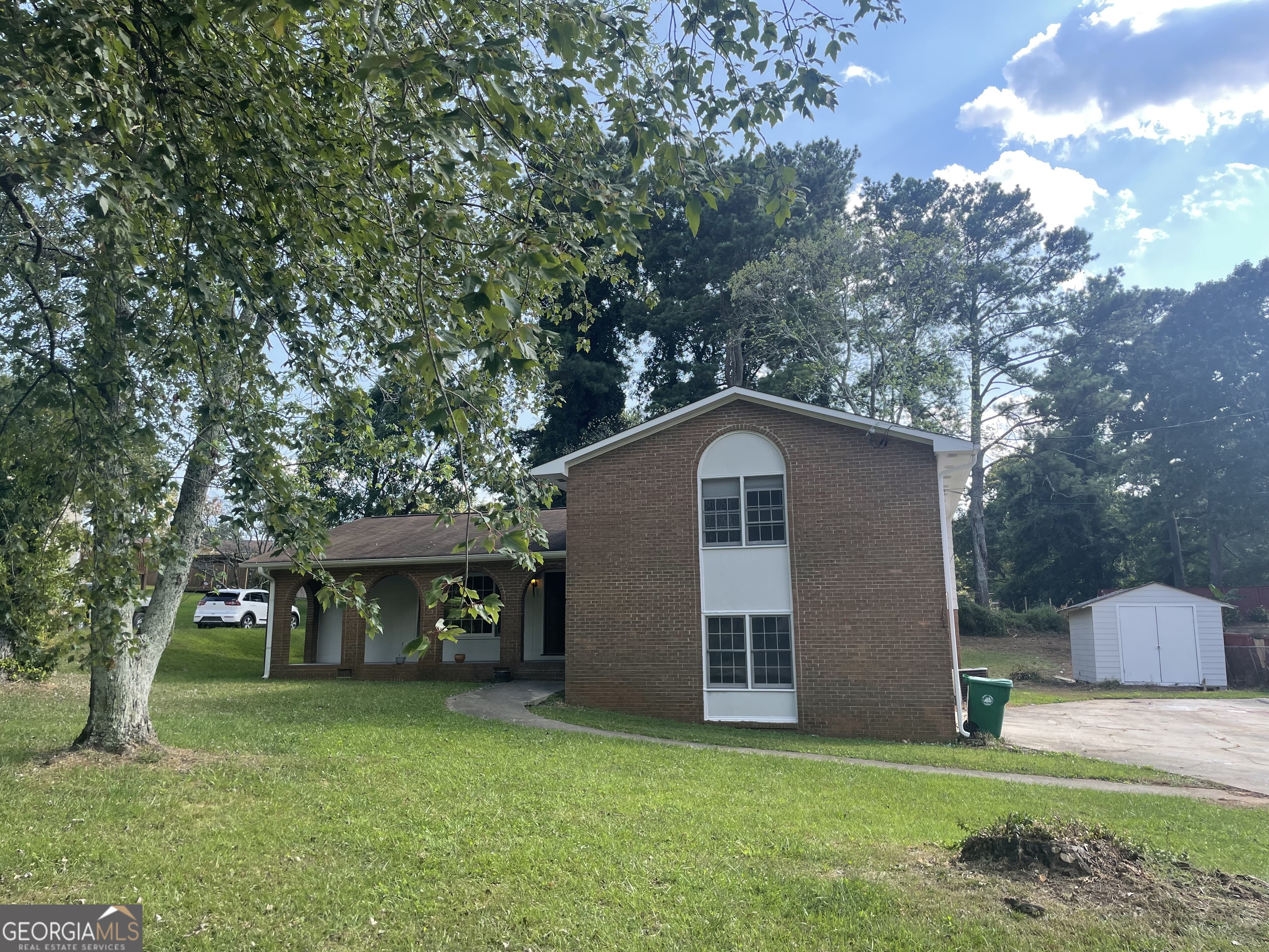 3753 Columbia Parkway Decatur, GA 30034 - Photo 4 of 14 a front view of a house with a garden and trees