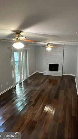 a view of a livingroom with wooden floor