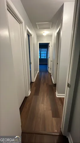 a view of entryway with wooden floor
