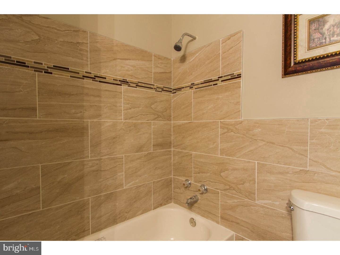 360 Windermere Avenue Lansdowne, PA 19050 - Photo 3 of 20 Elegant bathroom with modern tile accents.
