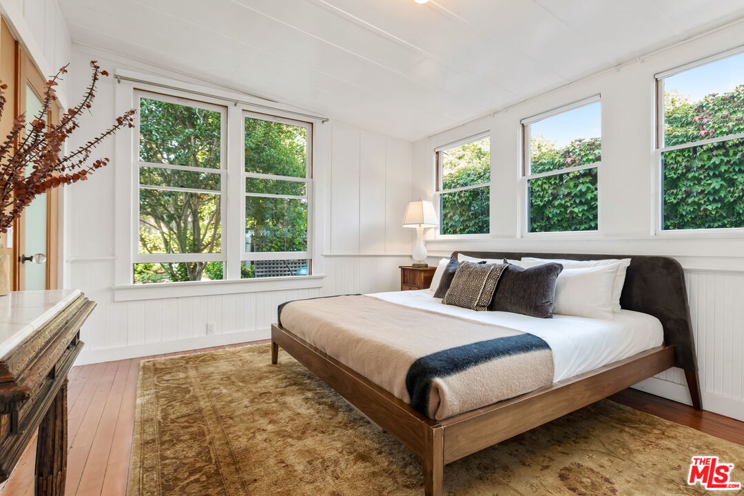 2621 2nd Street Santa Monica, CA 90405 - Photo 15 of 33 a large bed sitting in a bedroom next to a window