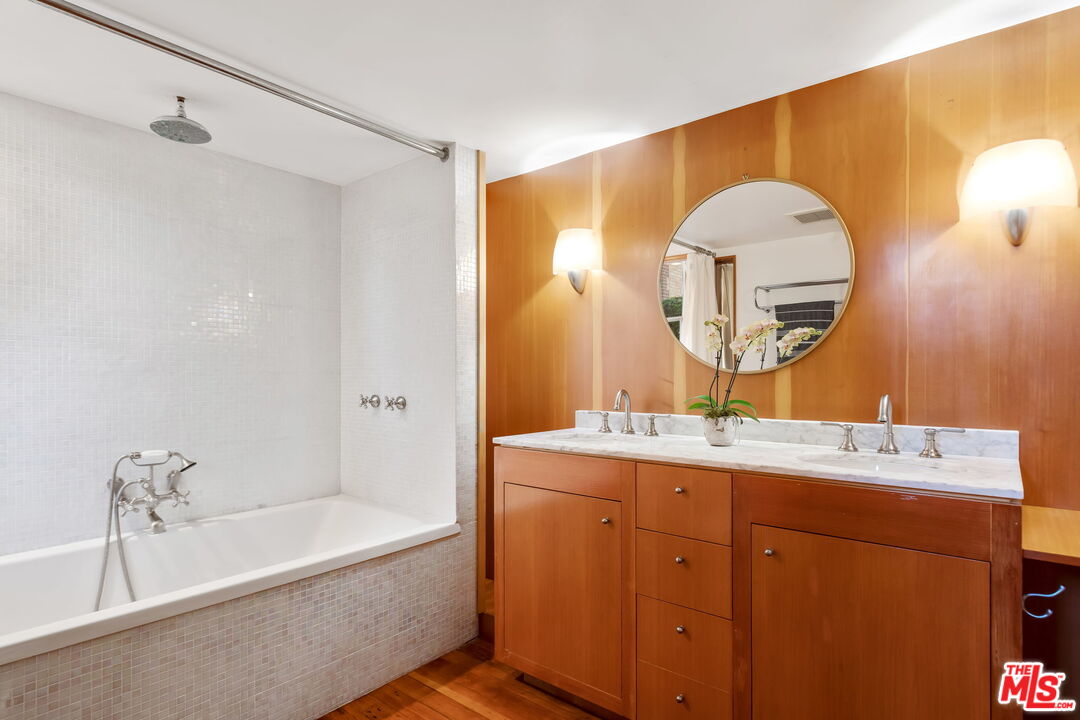 2621 2nd Street Santa Monica, CA 90405 - Photo 17 of 33 a bathroom with a tub sink and mirror