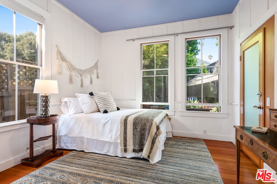 2621 2nd Street Santa Monica, CA 90405 - Photo 18 of 33 a bedroom with a bed and a large window