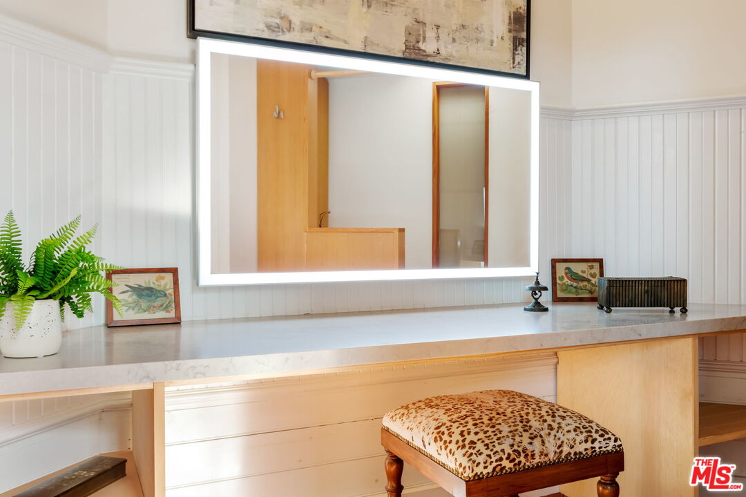 2621 2nd Street Santa Monica, CA 90405 - Photo 22 of 33 a bathroom with a granite countertop sink a mirror and a shower