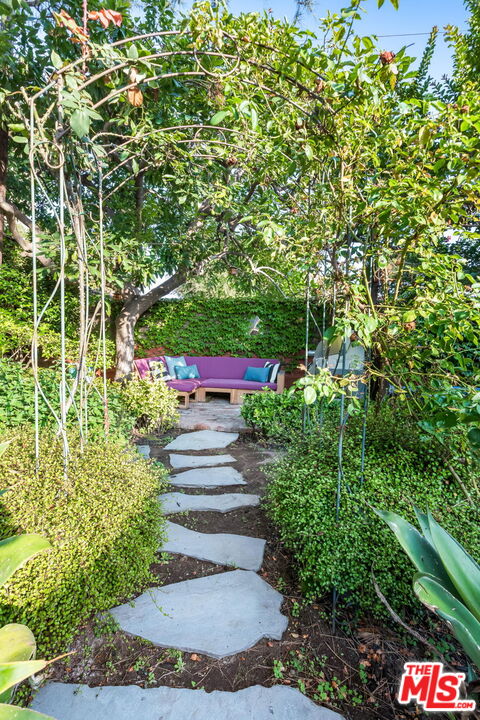 2621 2nd Street Santa Monica, CA 90405 - Photo 29 of 33 a view of flower garden with a bench