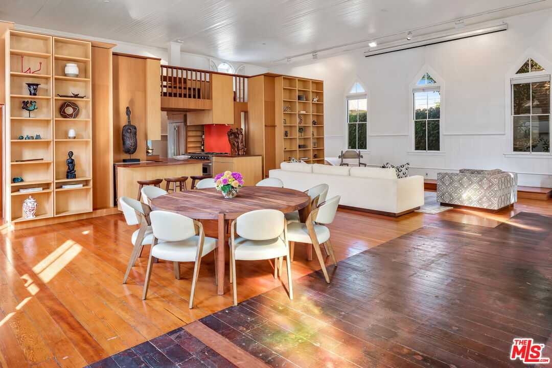 2621 2nd Street Santa Monica, CA 90405 - Photo 9 of 33 a dining room with wooden floor and large windows