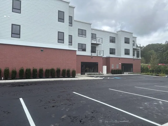 a front view of a building with a road