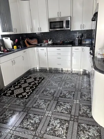 a bathroom with a shower and a sink