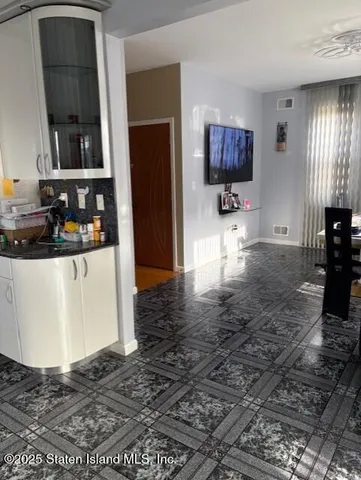 a white toilet sitting next to a bathroom sink