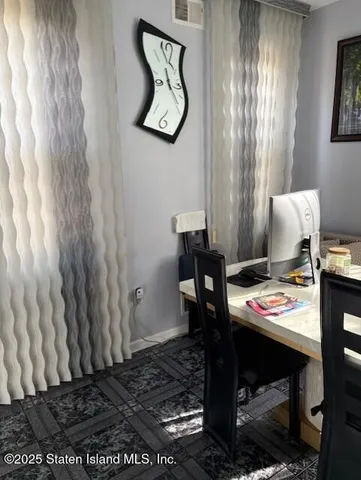 a bathroom with a sink a toilet and a window