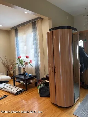 a view of a chairs and table in the balcony