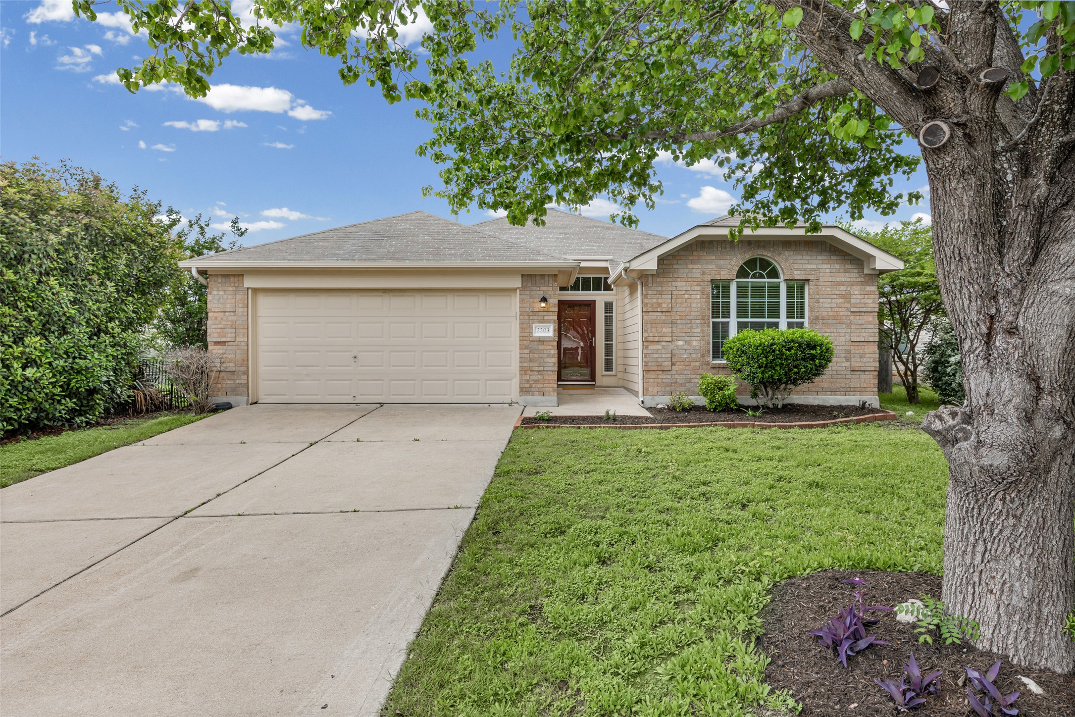 2203 Bakers Way Cedar Park, TX 78613 - Photo 1 of 1 a front view of a house with garden