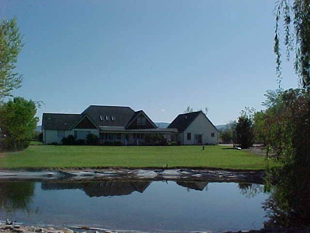 1650 Lombardy Road Gardnerville, NV 89410 - Photo 4 of 8 a front view of a house with a yard and garage
