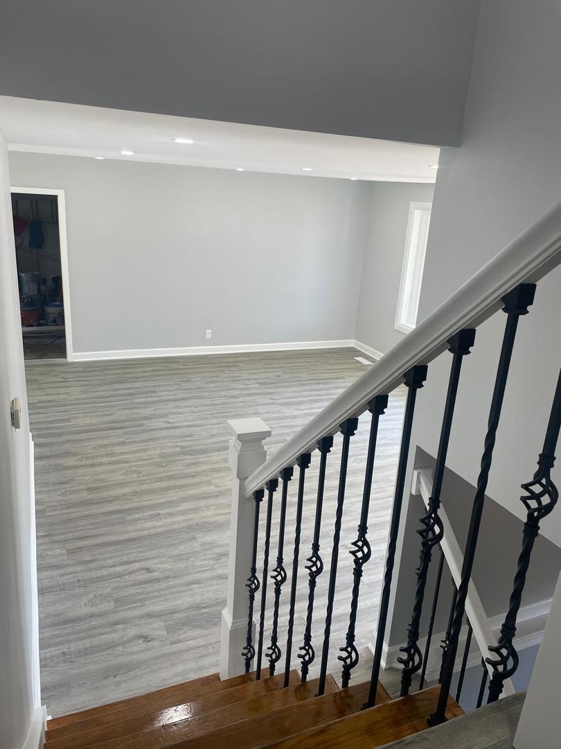 573 Redwood Road Bolingbrook, IL 60440 - Photo 18 of 24 a view of staircase with railing and white walls