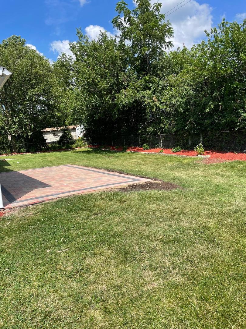 573 Redwood Road Bolingbrook, IL 60440 - Photo 23 of 24 a view of field with trees in the background