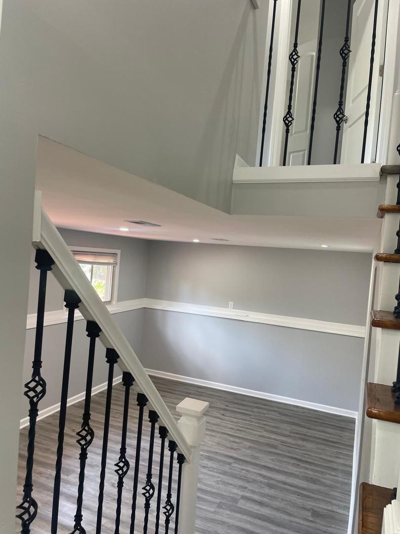 573 Redwood Road Bolingbrook, IL 60440 - Photo 8 of 24 a view of staircase with wooden floor and stairs