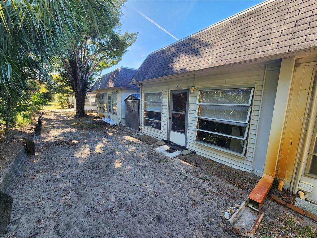 Undisclosed Address New Port Richey, FL 34652 - Photo 3 of 25 a view of a house with a yard