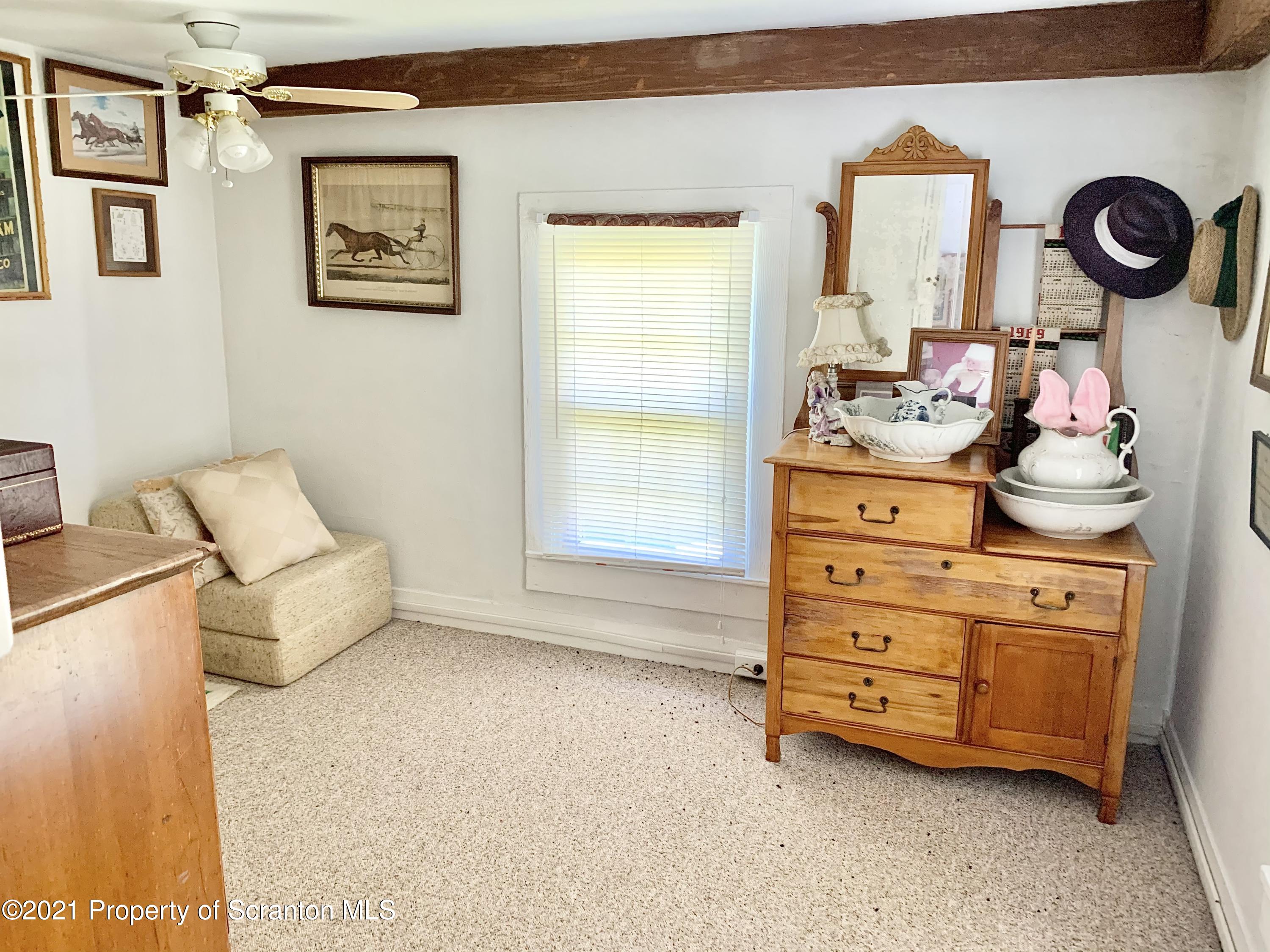 2745 West Nicholson Road Factoryville, PA 18419 - Photo 27 of 45 a room with a baby crib and a dresser