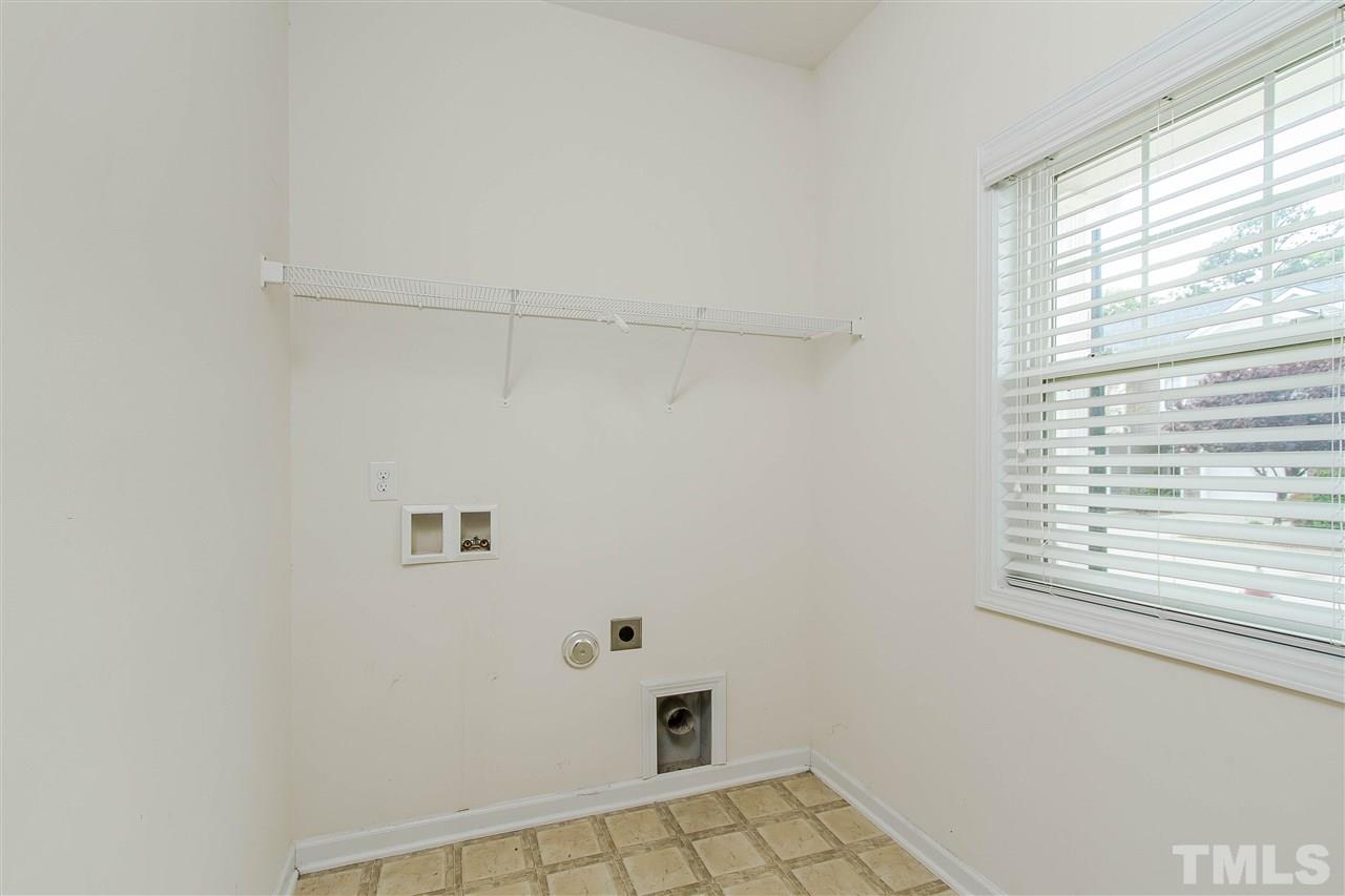 2540 Spring Oaks Way Raleigh, NC 27614 - Photo 17 of 21 First floor utility room, might even make laundry fun!