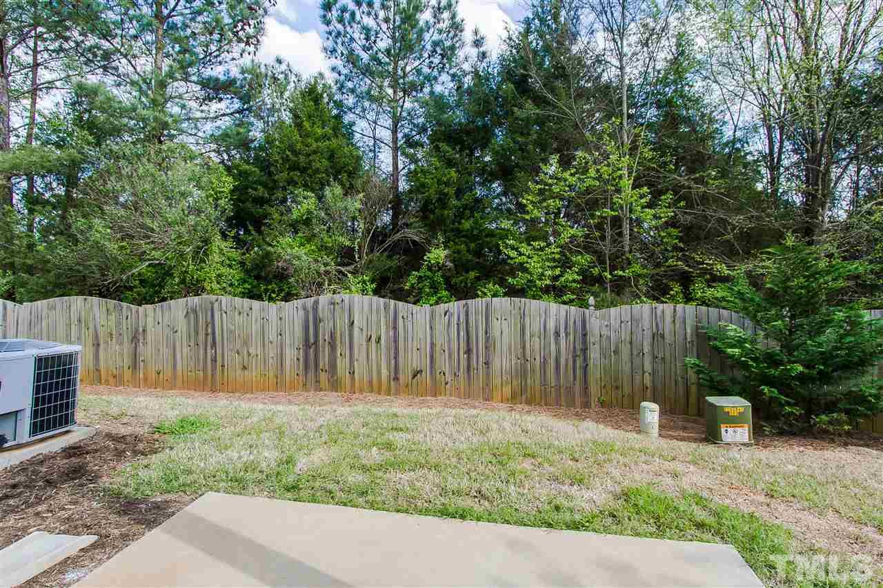 2540 Spring Oaks Way Raleigh, NC 27614 - Photo 19 of 21 Enjoy the Carolina breezes on your covered patio!